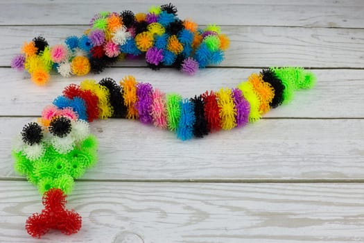 Snake from bunchems constructor, colored sticky balls with hooks, burdock toy