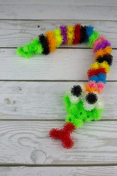 Snake made from sticky construction set, toy animal made from multi colored balls with hooks