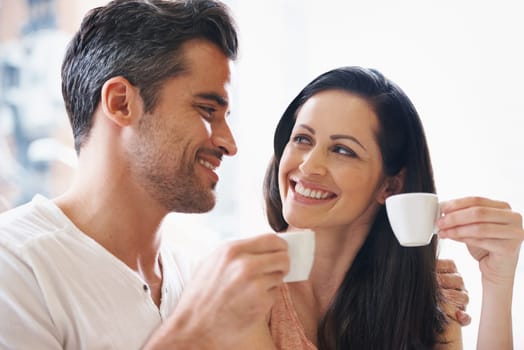 Talking, smile and couple with coffee on date for romance or anniversary in cafeteria. Happy, bonding and young man and woman in conversation drinking latte, espresso or cappuccino at restaurant