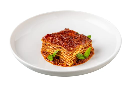 Bechamel sauce and minced meat lasagna on white background