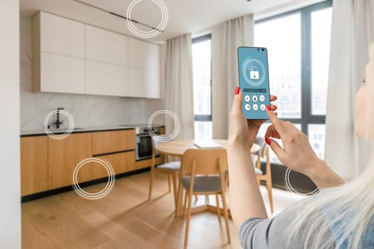 Hand of woman holding smartphone in blurred kitchen with double exposure of smart home interface. Concept of automation