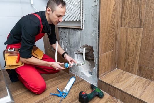 Construction man using hammer and tool while demolish wall. High quality photo