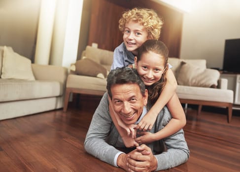 Portrait, home and grandfather on the floor, grandchildren and happiness with stack and vacation. Face, apartment and elderly man with grandkids or bonding together with fun and playing with siblings.