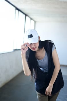 Young beautiful hip hop dancer dancing in an abandoned building. Movement and active lifestyle concept.