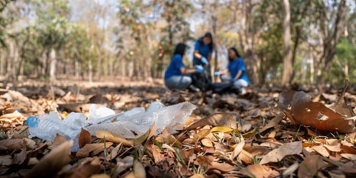 Garbage collect volunteer collect up plastic bottles put garbage at parks avoid pollution be friendly to the environmental and ecosystem.