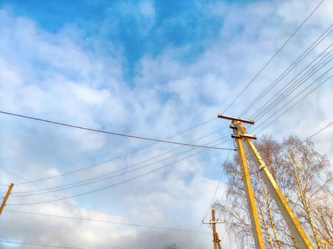 Old pole with wires against the sky. Electric transmission line, Eco-friendly energy