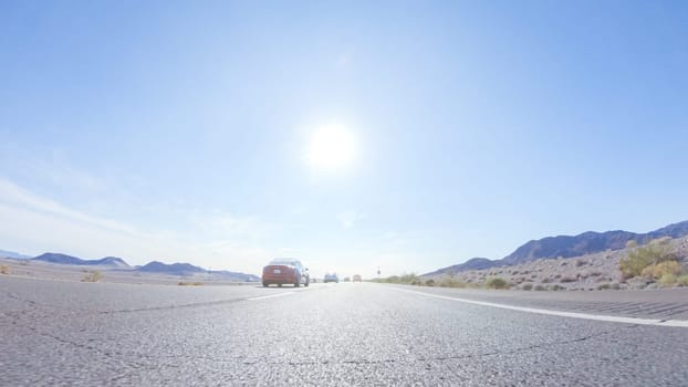 Embarking on a road trip from Nevada to California, driving on Highway 15 during the day offers scenic views and an exciting journey between states.