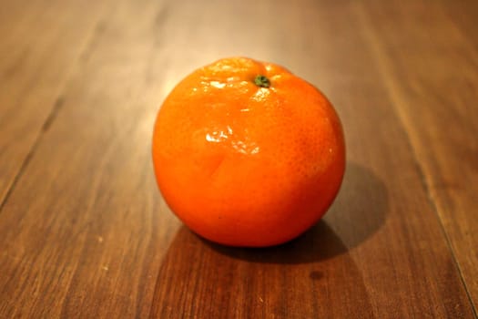 tangerine on an table, tropical fruit