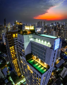 Rooftop pool with Bangkok skyline view at sunset, in Bangkok Thailand, south east asia