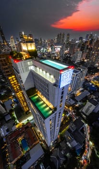 Rooftop pool with Bangkok skyline view at sunset, in Bangkok Thailand, south east asia