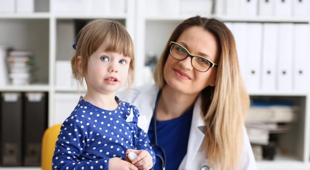 Little child with mother at pediatrician reception. Physical exam cute infant portrait baby aid healthy lifestyle ward round child sickness clinic test high quality and trust concept