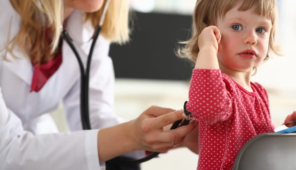 Little child with mother at pediatrician reception. Physical exam, cute infant portrait, baby aid, healthy lifestyle, ward round, child sickness, clinic test, high quality and trust concept