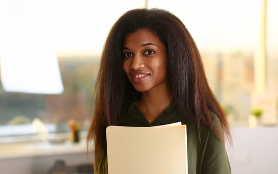 Beautiful black smiling businesswoman portrait at workplace look in camera. White collar worker at workspace exchange market job offer certified public accountant internal revenue officer concept