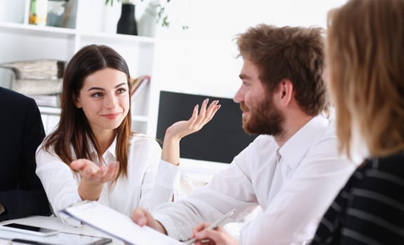 Group of people deliberate on white board problem in office closeup. Graph consult idea participate creative talk review situation job document explain council train successful decision concept