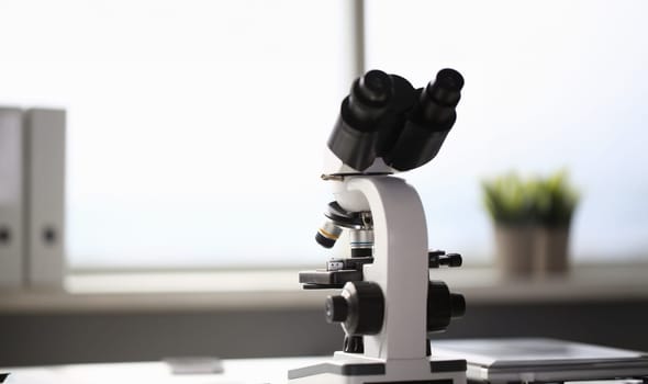 The head microscope on the background laboratory is a study human biology analyzes for non-compliance with the requirements organization public health at international level