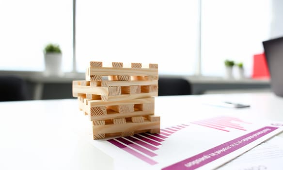pallets tower lie on table charts with financial statistics cargo delivery concept