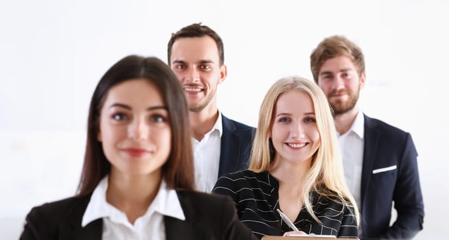 Group of smiling people stand in office looking in camera portrait. White collar power mediation solution project creative advisor participation profession train bank lawyer client visit concept