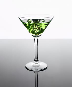 Cocktail absinthe with vodka in martini glass print print for skinned kitchen background interior bar products home furnishings trendy design black gray gradient sliced fruits and ice.