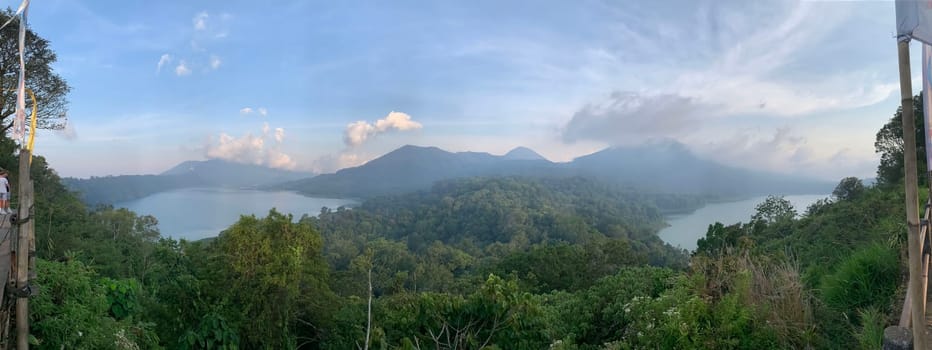 beautiful panorama of beautiful countryside of twin lake in bali. sunny afternoon. wonderful springtime landscape in mountains. grassy field and rolling hills. rural scenery