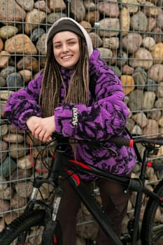 European stylish woman riding a sports bike around the city.