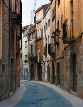 Narrow street in the old town of Cardona, Spain