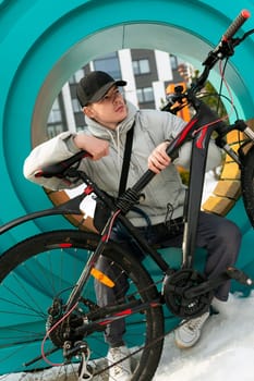 European man sitting and resting between bike rides.