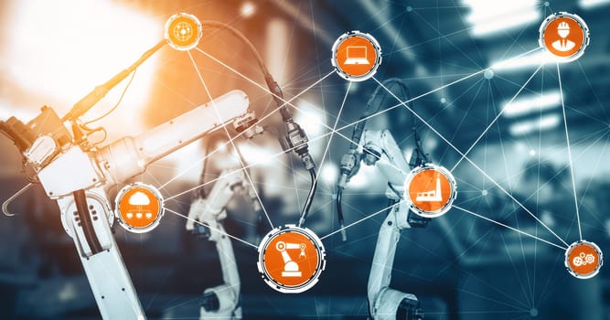 XAI Smart industry robot arms for digital factory production technology showing automation manufacturing process of the Industry 4.0 or 4th industrial revolution and IOT software to control operation.