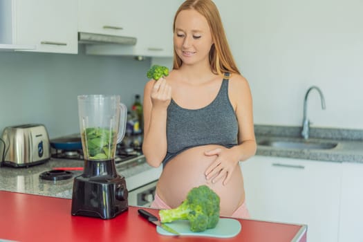 Embracing a nutritious choice, a pregnant woman joyfully prepares a vibrant vegetable smoothie, prioritizing wholesome ingredients for optimal well-being during her maternity journey.