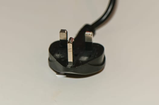 black plug from English standard socket on the table