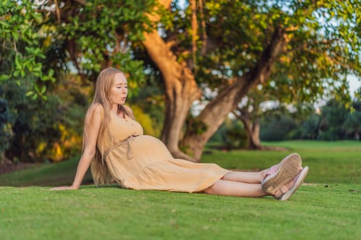 pregnant woman finds joy and serenity, relishing a tranquil moment outdoors during her pregnancy journey.