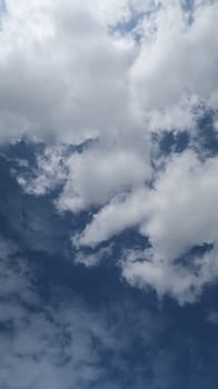 Heavenly white clouds on the blue sky with the sun appeared perfect for multimedia texture or background and content creation