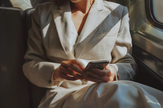 Businesswoman inside of a car using mobile phone, daily use of smartphone.