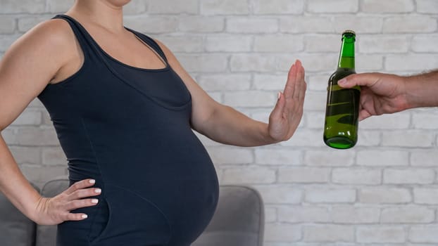A pregnant woman refuses beer