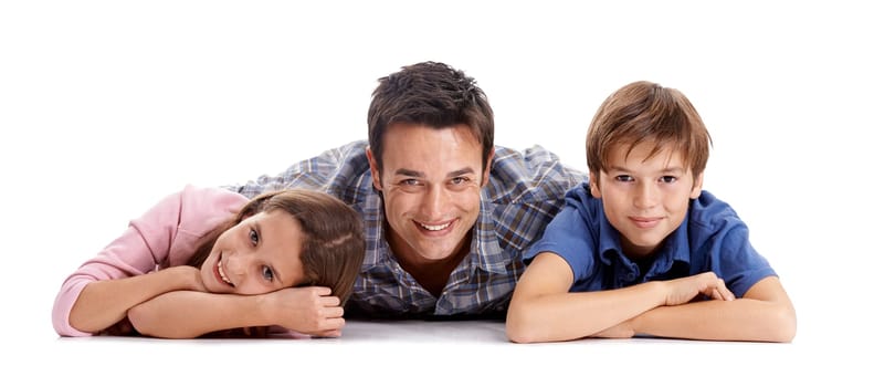 Happy, white background and dad and kids on floor for bonding, relationship and love. Family, parenthood and dad hug, embrace and smile with girl and boy for support, care and affection in studio.
