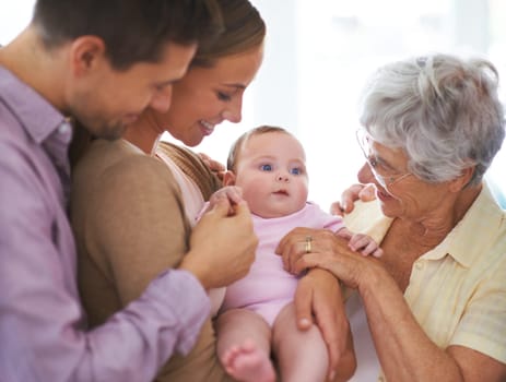 Family, grandmother with baby and parents are happy at home, people bonding with love and relationship. Support, trust and care, smile for pride and generations, childhood and connect with infant.