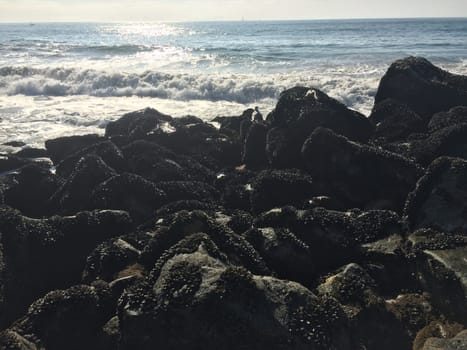 Waves Crashing along Rocky Shore near Los Angeles, California. High quality photo