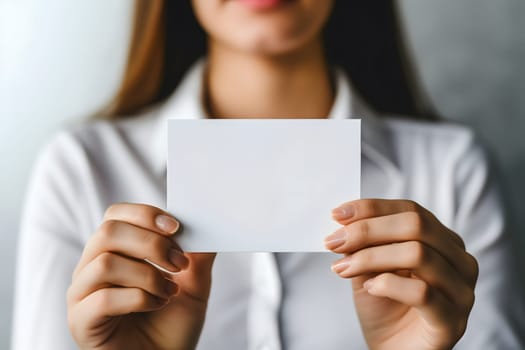 Long-haired young adult Caucasian woman Hand holding blank business card on white background. Neural network generated image. Not based on any actual scene or pattern.