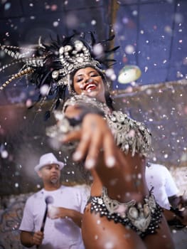 Dance, performance and woman samba at carnival, festival and event in Brazil for summer celebration of culture. Happy, dancer and creative fashion for salsa, party and night with confetti and music.