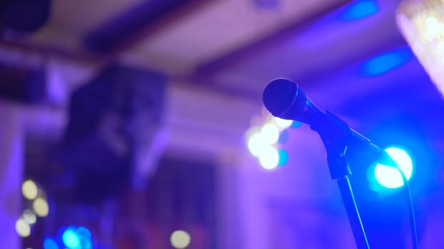 Microphone on stage. Karaoke, night club, bar. Music concert. Song, music concept.