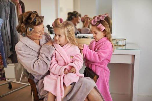 Fashion, hair and mother with children in wardrobe for dressing, getting ready and choose outfit. Family, beauty and mom and young girl with clothing, style and makeover for bonding, fun or cosmetics.