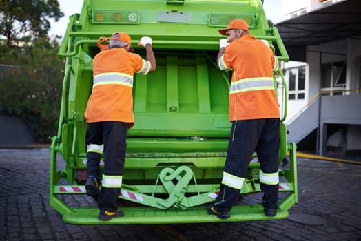 Worker, garbage truck and collection service on street or public environment with teamwork or junk, recycling or waste management. Uniform, maintenance and New York dirt, transportation or sanitation.