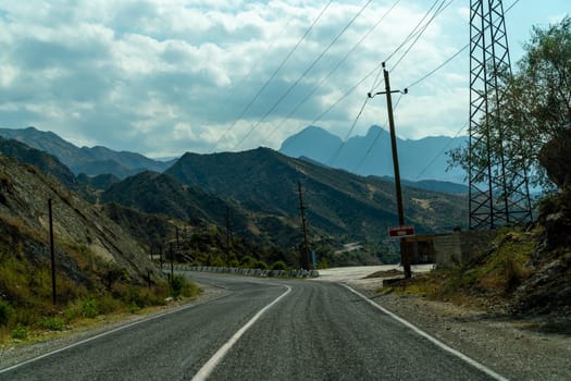 View from the car of an asphalt road in the mountainous area of Dagestan.