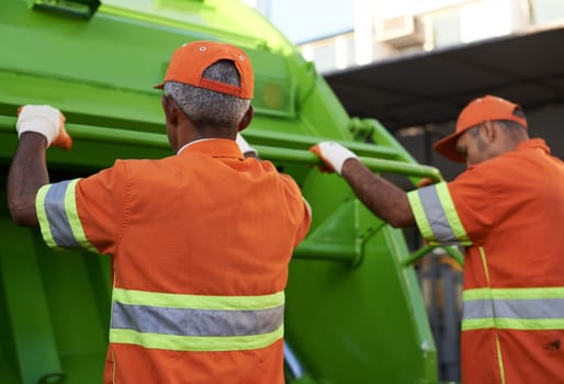 Garbage collector, men and truck for waste management and teamwork with routine and cleaning the city. Employees, recycle and environment with transportation and green energy with trash and service.