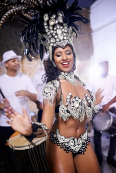 Samba, dance and woman in performance at carnival, festival and event in Brazil for summer celebration of culture. Salsa, dancer and creative fashion at party with energy to music or people at club.