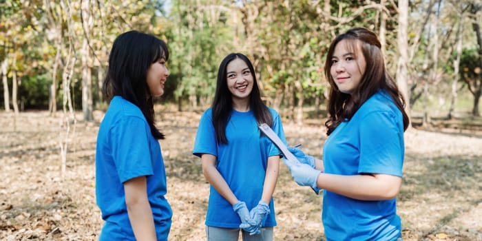 Group of volunteers, community members cleaning the nature from garbage and plastic waste to send it for recycling.