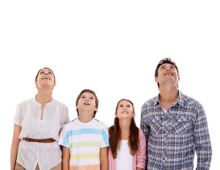 Mother, father and kids on a white background looking up for bonding, relationship and mockup space. Family, love and isolated mom, dad and children for news, information and announcement in studio.