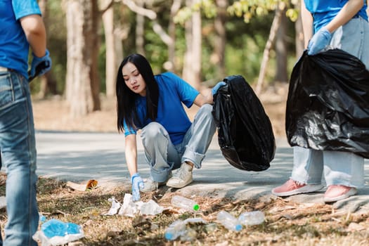 Group of volunteers, community members cleaning the nature from garbage and plastic waste to send it for recycling.