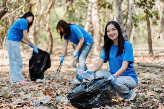Group of volunteers, community members cleaning the nature from garbage and plastic waste to send it for recycling.