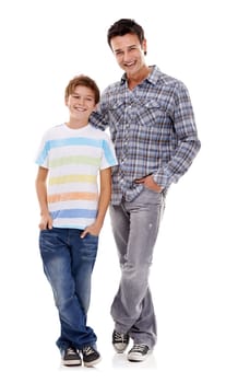 Happy father, portrait and hug with kid in fashion for family or bonding on a white studio background. Dad, son or child with smile in casual clothing, support or trust for parenthood or childhood.