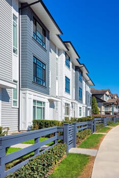 A perfect neighbourhood. Brand new townhouses for sale on spring season in Vancouver, Canada.